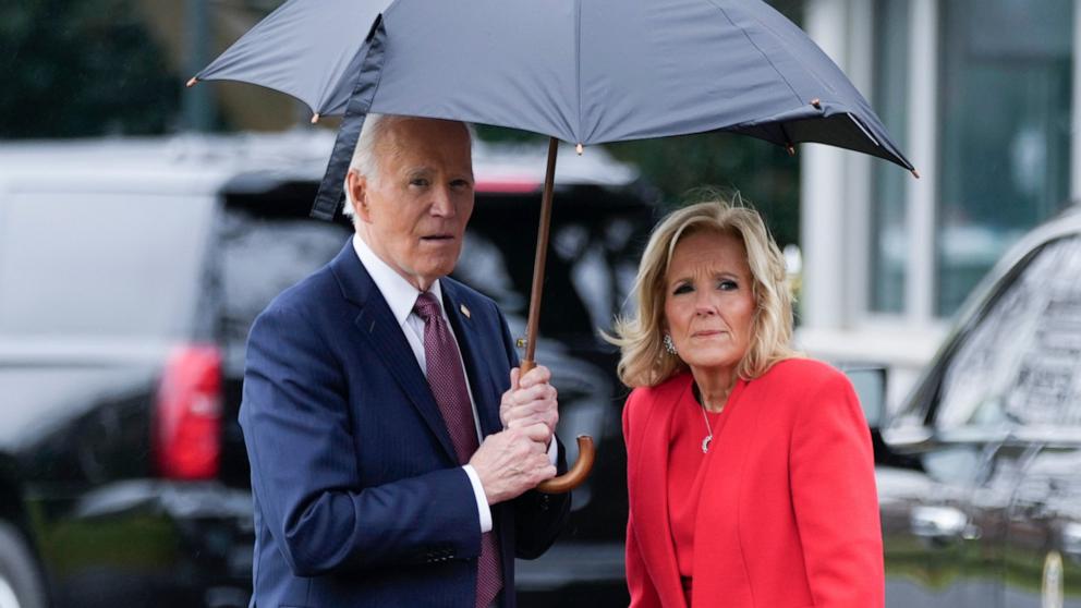 PHOTO: President Joe Biden and First Lady Jill Biden stand for a group photograph with White House staff members outside the White House on Dec. 20, 2024, in Washington, D.C.