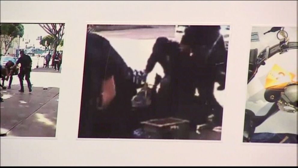 PHOTO: LAPD chief Charlie Beck showed video stills from footage shot by onlookers that he alleges shows the man reaching for the police officer's weapon.