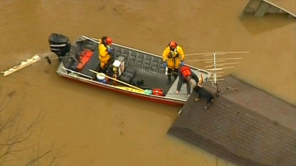 PHOTO: Firefighters rescued a man and his dog from the roof of a home in Eureka, Mo. 