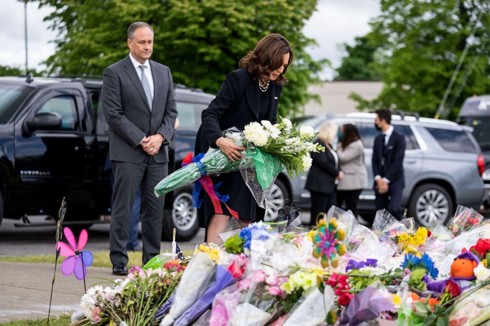 PHOTO: Vice President Kamala Harris and Second Gentleman Doug Emhoff pay their respects on May 28, 2022, at a memorial at Tops Friendly Market, the site of a mass shooting in Buffalo, New York.