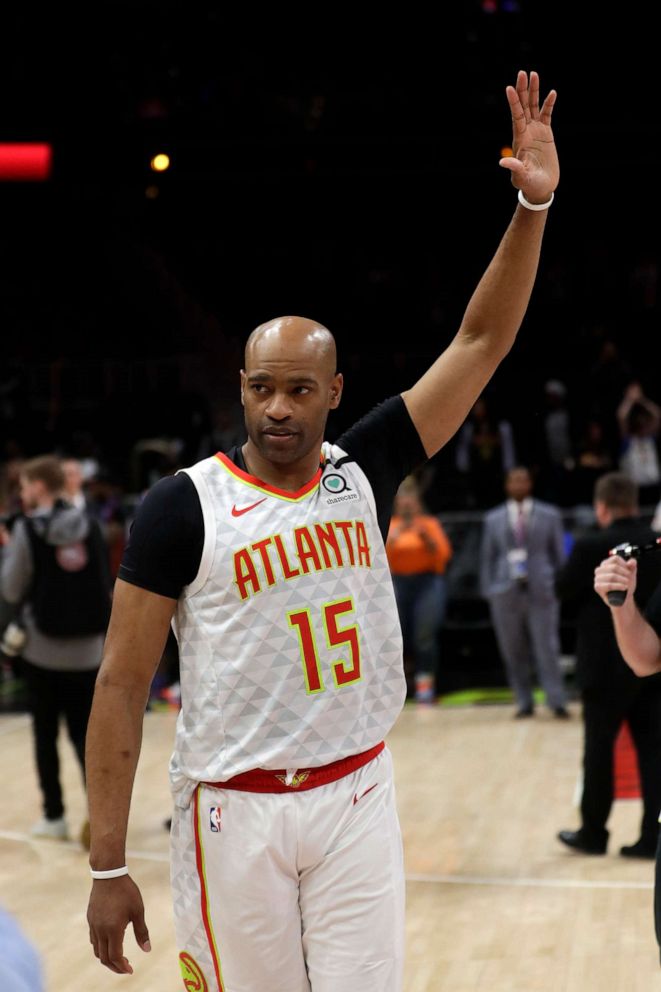 PHOTO: Atlanta Hawks guard Vince Carter (15) wavs to the crowd as he leaves the court following an NBA basketball game against the New York Knicks Wednesday, March 11, 2020, in Atlanta. 