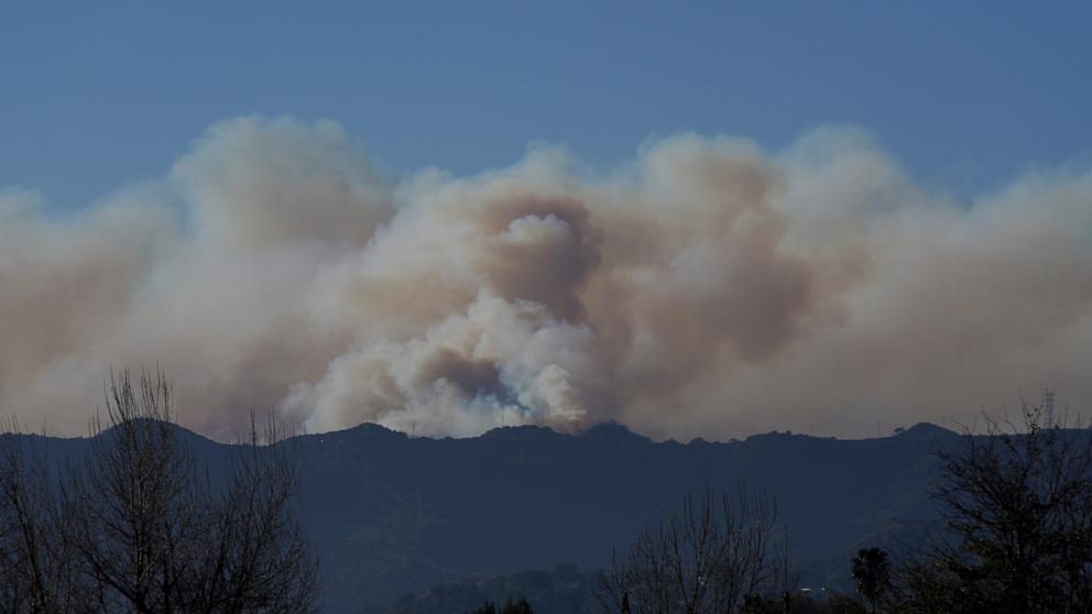 PHOTO: Smoke from the Palisades Fire rises over a ridge on Jan. 11, 2025, in Los Angeles.