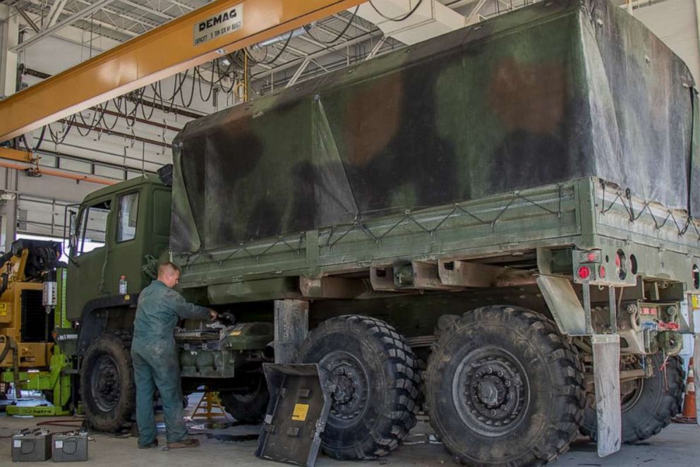 PHOTO: U.S. Army Cpl. Dean Jones, Vermont National Guard, inspects a Light Medium Tactical Vehicle (LMTV) at Camp Johnson in Colchester, Vt., July 19, 2018.