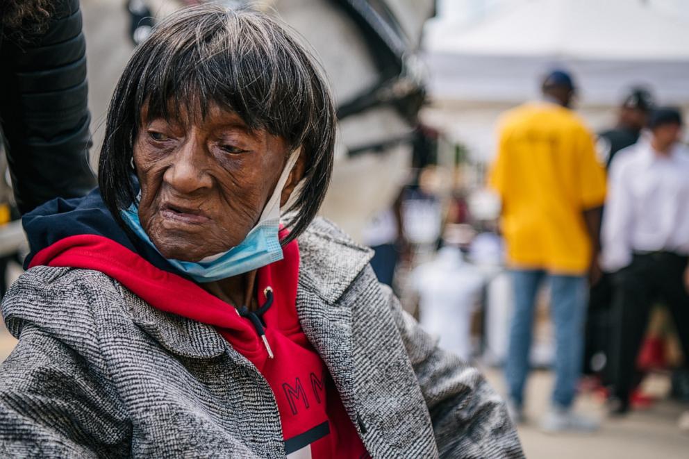 PHOTO: Tulsa massacre survivor Lessie Benningfield Randle, 106, waits to be escorted in the Greenwood district of Tulsa on May 28, 2021 in Tulsa, Oklahoma. 