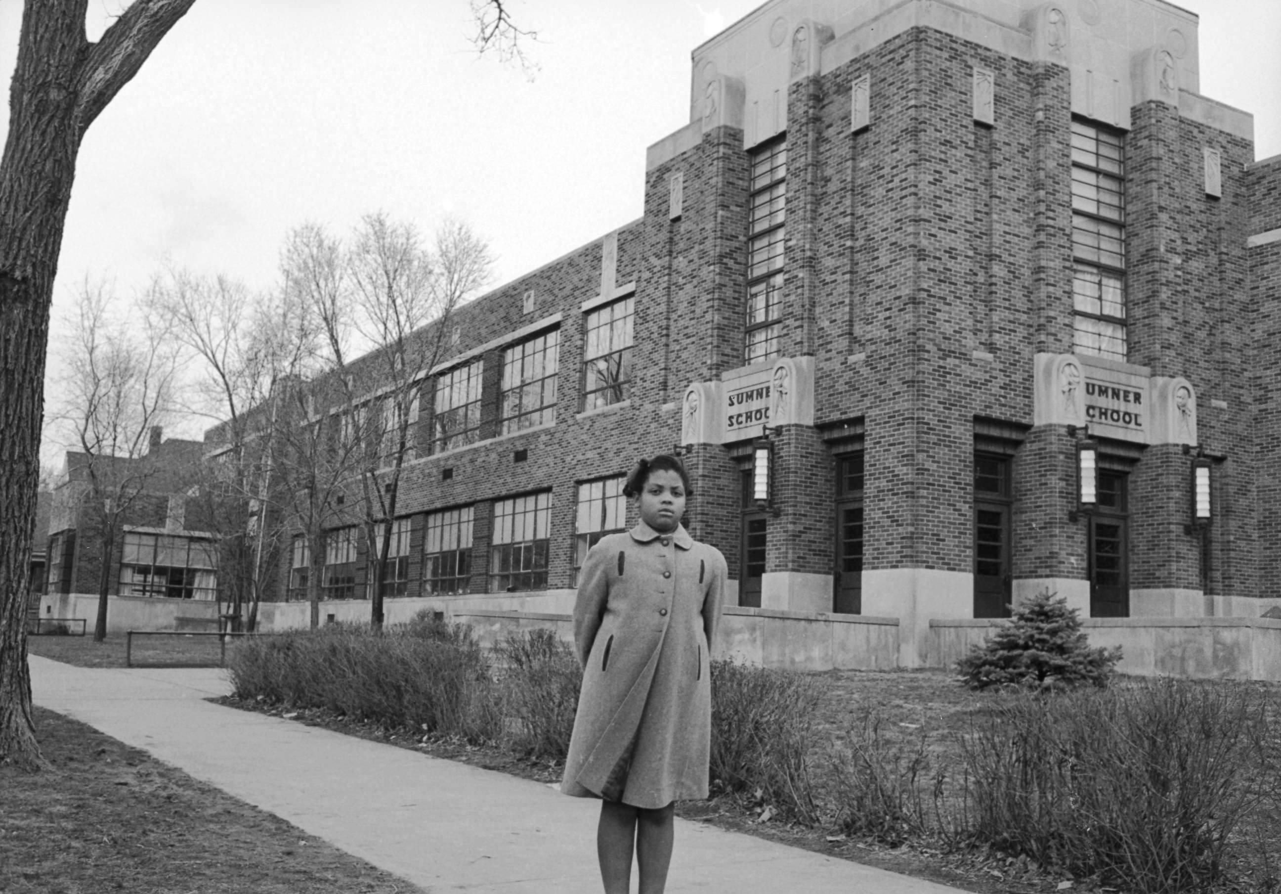 PHOTO: Nine-year-old Linda Brown poses outside Sumner Elementary School, Topkea, Kan., in 1953. 