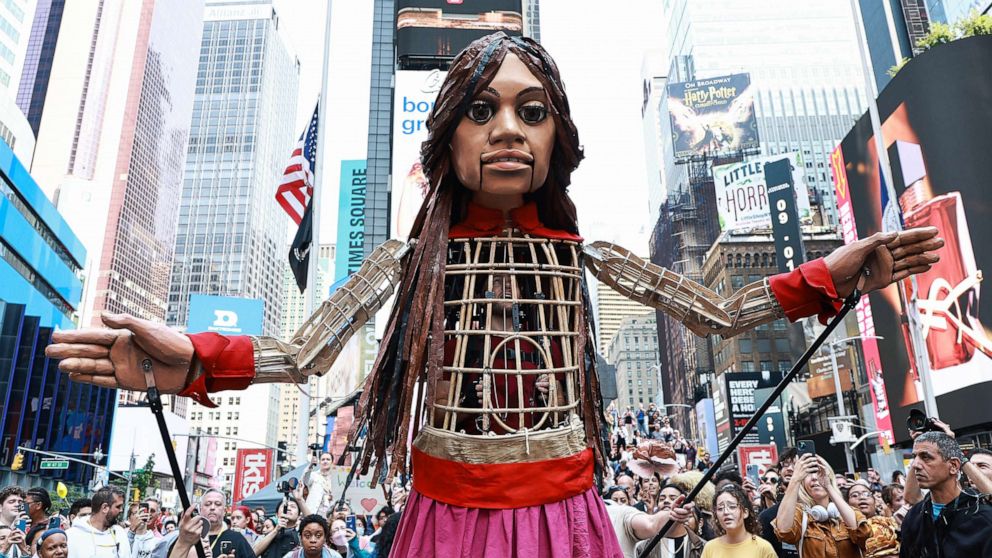 PHOTO: A 12-foot puppet known as "Little Amal" symbolizing a 10-year-old Syrian refugee girl, walks through Times Square, Sept. 16, 2022, in New York City.