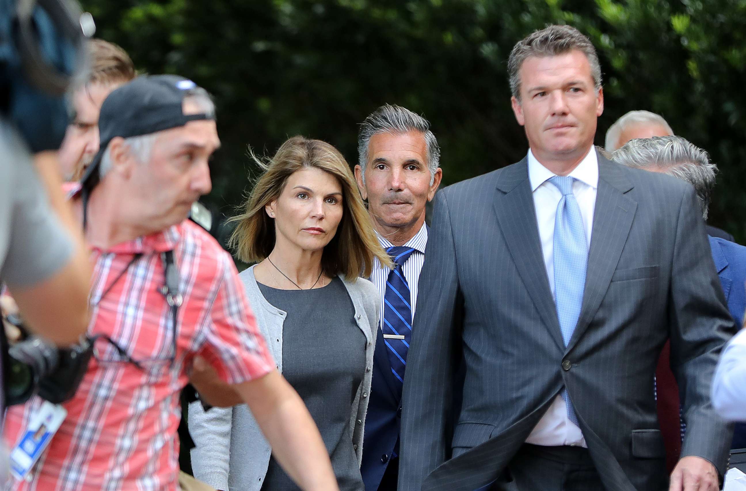 PHOTO: Lori Loughlin and her husband Mossimo Giannulli leave the John Joseph Moakley United States Courthouse in Boston, Aug. 27, 2019. 