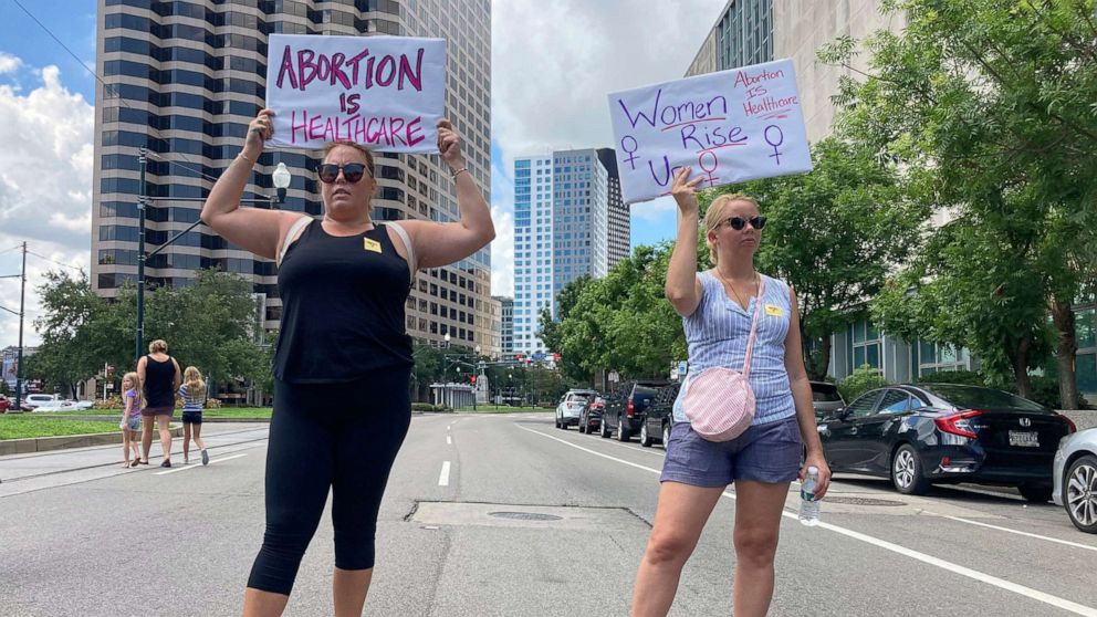 PHOTO: Protesters wave signs and demonstrate in support of abortion access in front of a New Orleans courthouse, July 8, 2022. 