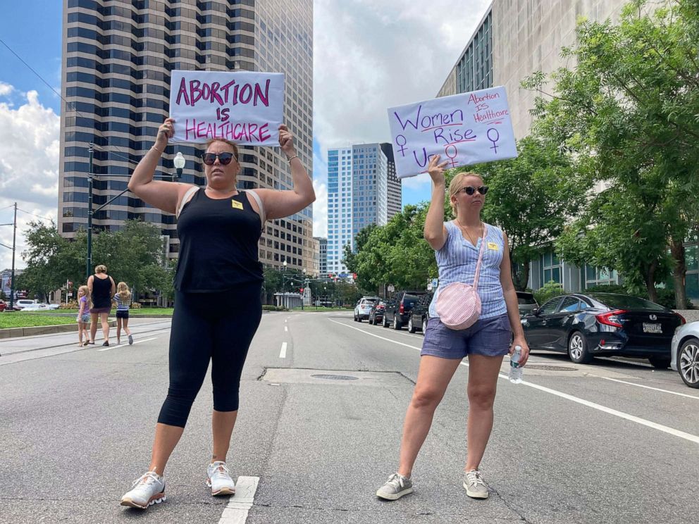 PHOTO: Protesters wave signs and demonstrate in support of abortion access in front of a New Orleans courthouse, July 8, 2022. 
