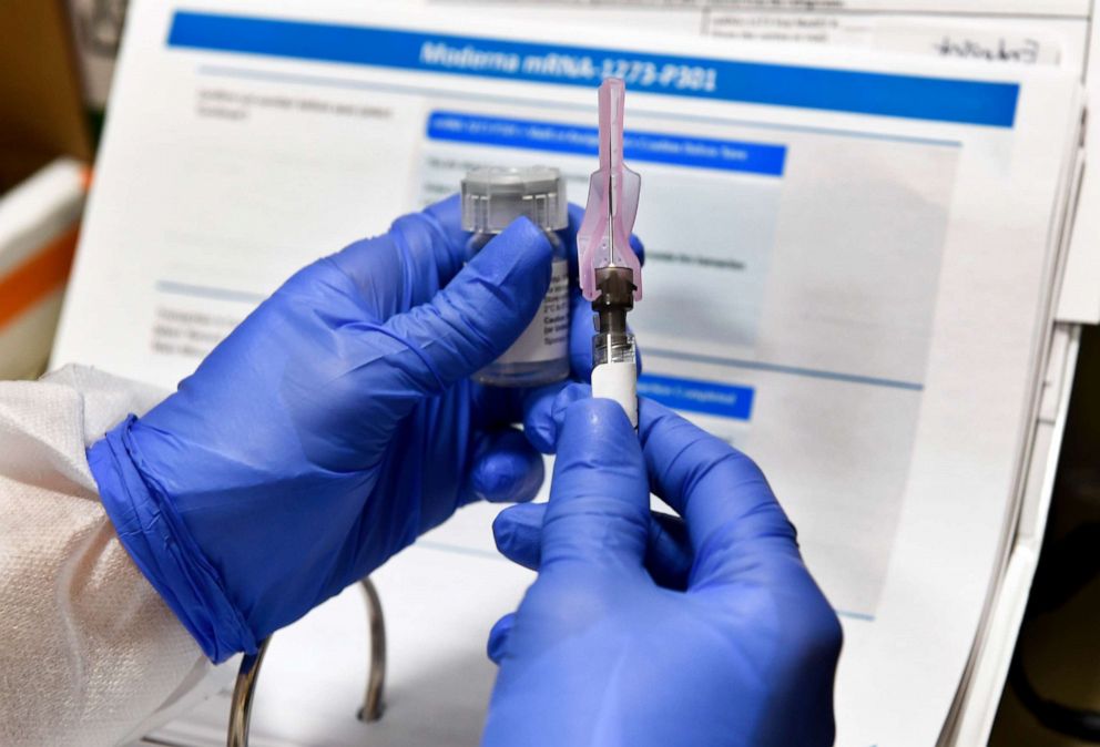 PHOTO: FILE - In this July 27, 2020, file photo, Nurse Kathe Olmstead prepares a shot that is part of a possible COVID-19 vaccine, developed by the National Institutes of Health and Moderna Inc., in Binghamton, N.Y.  