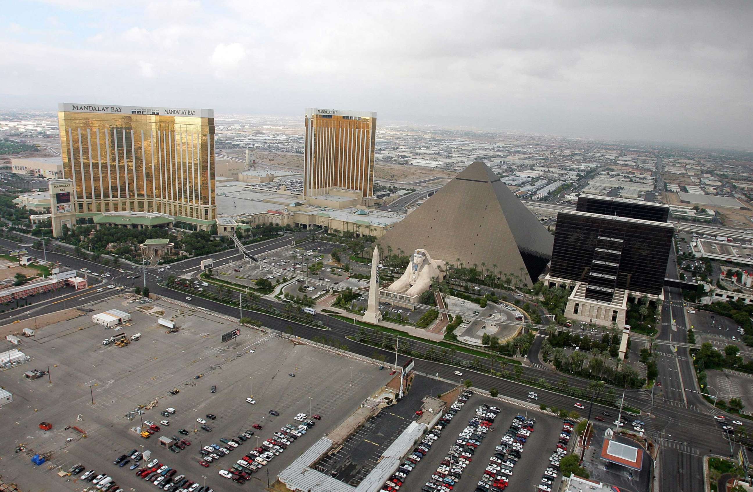 PHOTO: A 2005 file photo shows the Mandalay Bay Resort & Casino, left, the Luxor Hotel and Casino, right, and the lot where concertgoers were shot during a mass shooting on Oct. 1, 2017 in Las Vegas.