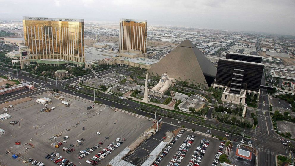 PHOTO: A 2005 file photo shows the Mandalay Bay Resort & Casino, left, the Luxor Hotel and Casino, right, and the lot where concertgoers were shot during a mass shooting on Oct. 1, 2017 in Las Vegas.