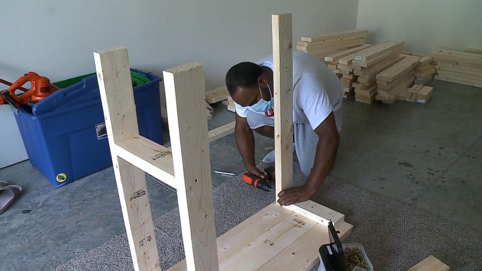 PHOTO: Marcus Holley, a father of three in Omaha, Nebraska, decided to build his own desks after he realized that they were sold out across his town. 