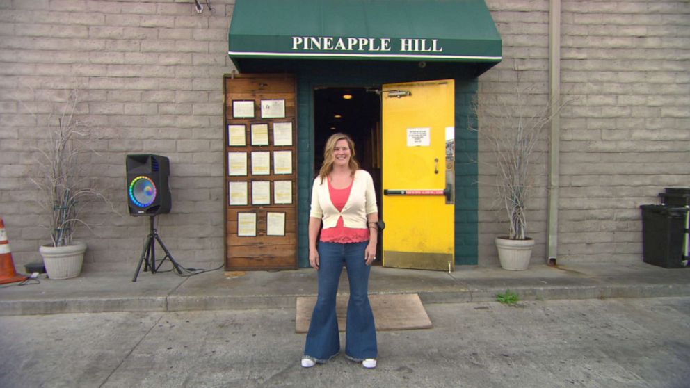 PHOTO: Angela Marsden, owner of Pineapple Hill Grill and Saloon, stands in front of her business, which has struggled to make ends meet during the pandemic. 