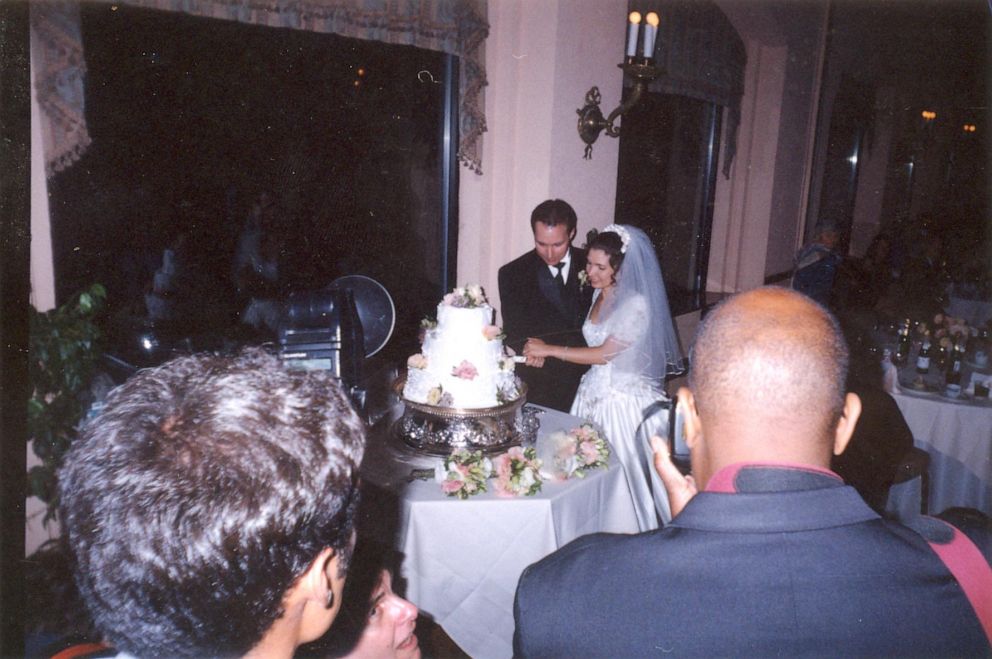 PHOTO: Melanie and Bill McGuire cut the cake at their wedding. 