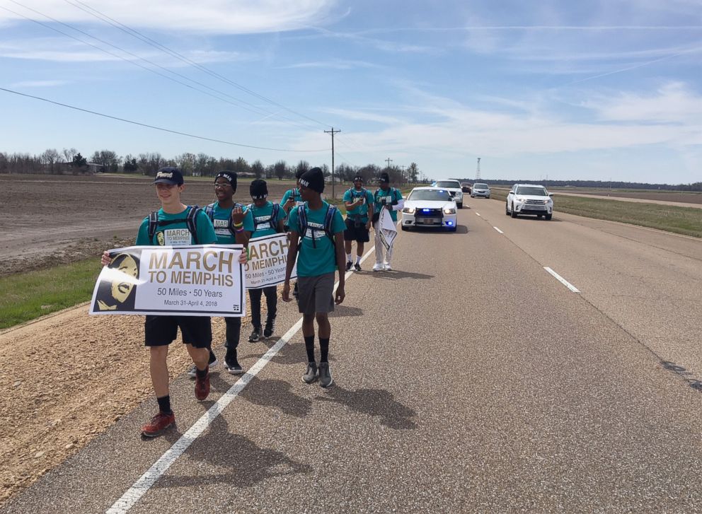 PHOTO: Marchers along Highway 61 completed their first few miles, March 31, 2018. They were joined by a police escort provided by the Pearl Police Department, the Mississippi Highway Patrol and municipal and county law enforcement agencies.