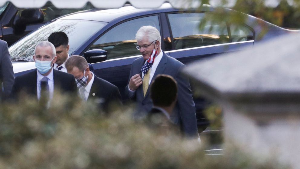 PHOTO: Michigan State Senate Majority Leader Mike Shirkey adjusts his protective face mask as he arrives to meet with U.S. President Donald Trump at the White House in Washington, U.S., November 20, 2020. 