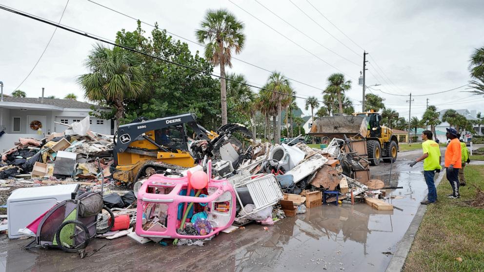 PHOTO: Salvage workers remove debris from Hurricane Helene flooding along the Gulf of Mexico before Milton arrives, Clearwater Beach, Fla., Oct. 7, 2024.