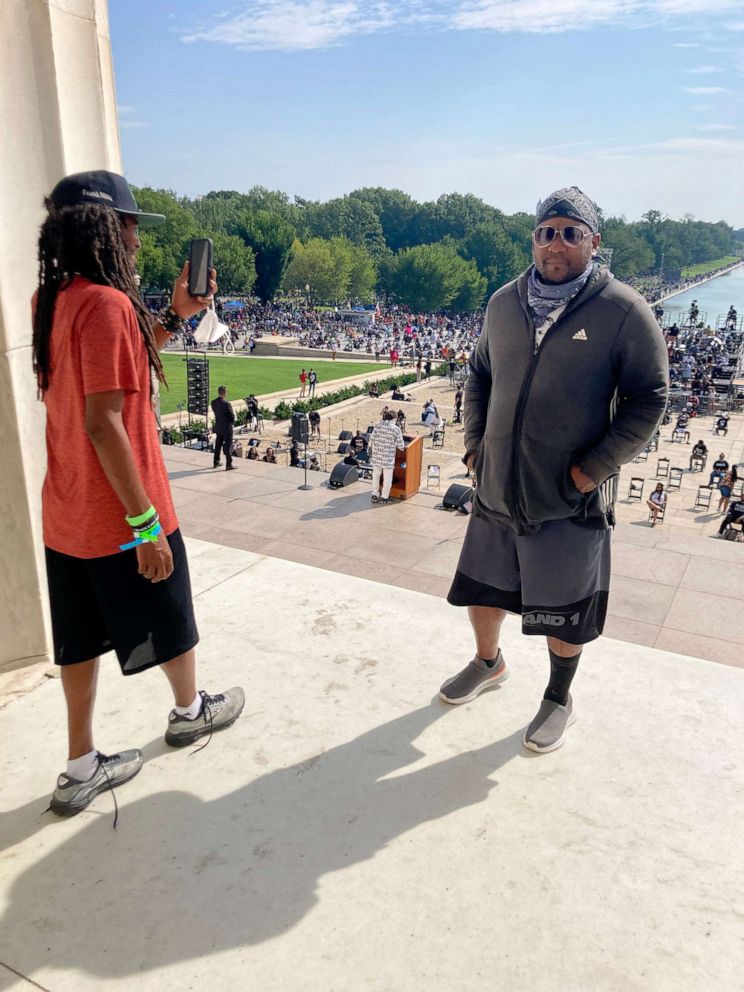 PHOTO: Tory Lowe and Frank Sensabaugh stand on the top of the steps at the Lincoln Memorial during the March on Washington.