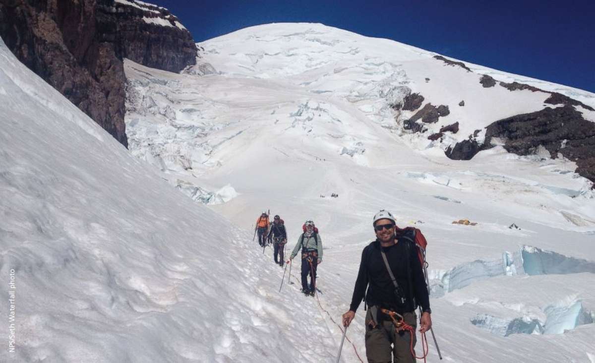 PHOTO: In this stock photo from the National Park Service, a rope team set for glacier travel with Ingraham Flats and Disappointment Cleaver in the background.