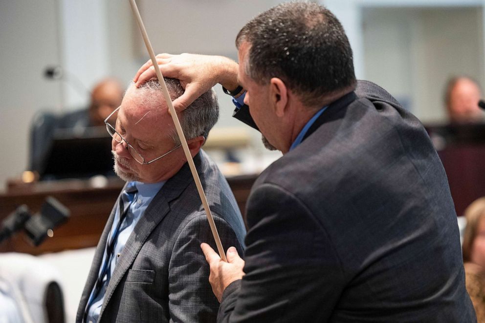 PHOTO: Crime scene specialist Kenneth Kinsey, right, shows where he believes a shotgun round entered Paul Murdaugh during Alex Murdaugh's double murder trial at the Colleton County Courthouse, Feb. 16, 2023, in Walterboro, S.C.