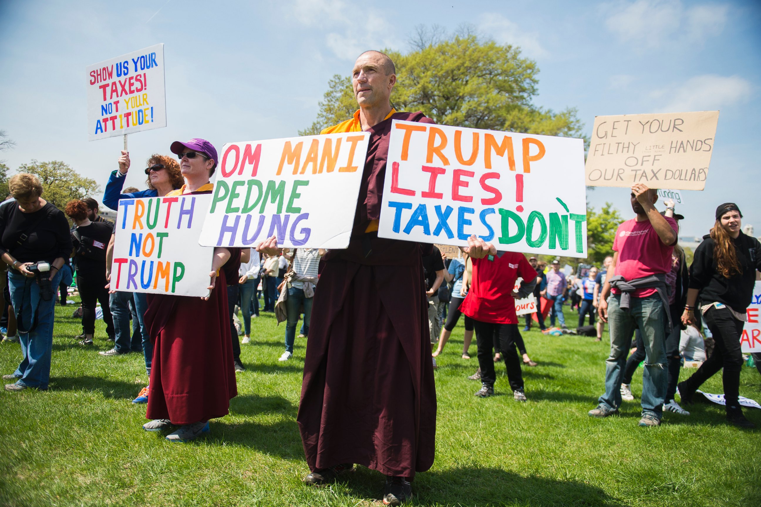 PHOTO: Buddhist monk Jampal Rowe of Poolesville, Md., attends the Tax March rally on the west lawn of the Capitol to call on President Trump to release his tax returns, April 15, 2017, in Washington.
