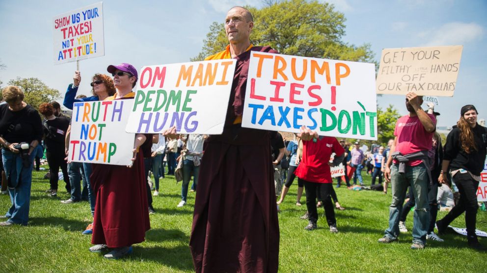 PHOTO: Buddhist monk Jampal Rowe of Poolesville, Md., attends the Tax March rally on the west lawn of the Capitol to call on President Trump to release his tax returns, April 15, 2017, in Washington.