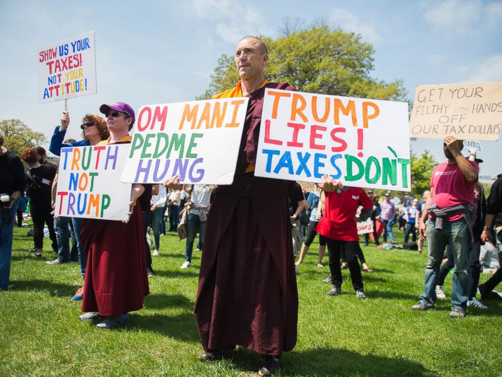 PHOTO: Buddhist monk Jampal Rowe of Poolesville, Md., attends the Tax March rally on the west lawn of the Capitol to call on President Trump to release his tax returns, April 15, 2017, in Washington.