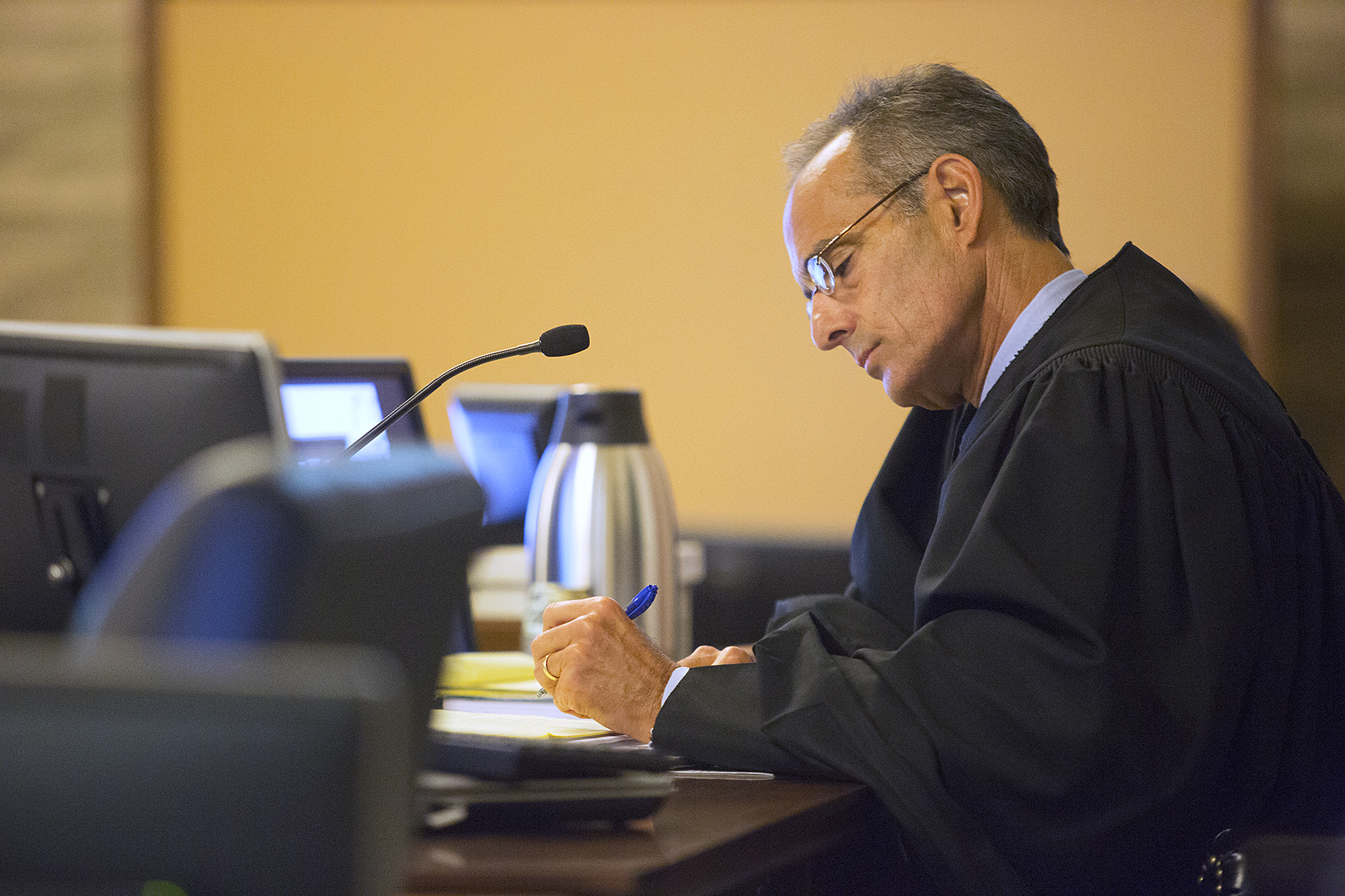 PHOTO: Judge Felix Catena takes notes during a morning of opening statements for the Oral "Nick" Hillary trial at the St. Lawrence County Courthouse in Canton, N.Y., Sept. 12, 2016. 