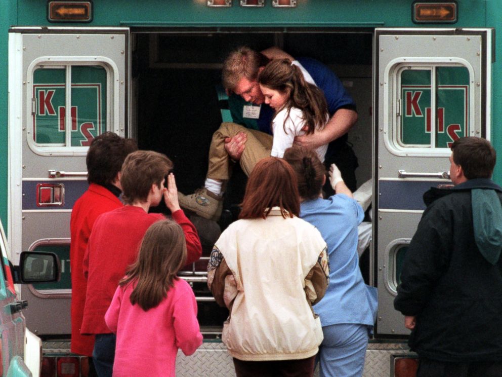 PHOTO: An emergency worker carries a young girl from an ambulance outside Westside Middle School in Jonesboro, Ark., Mar. 24, 1998. Four classmates and a teacher were killed when Mitchell Johnson and Andrew Golden opened fire at the school.