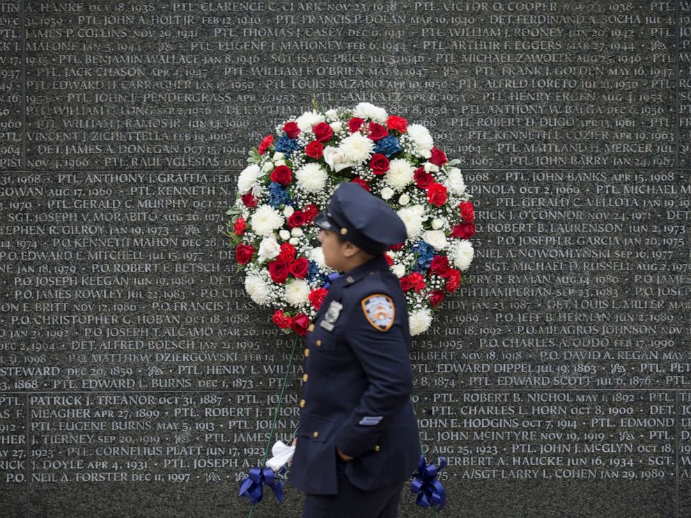 PHOTO: A police officer walks along the NYC Police Memorial wall during a NYPD memorial ceremony in the Battery Park City neighborhood of N.Y., in this Oct. 10, 2014 file photo.