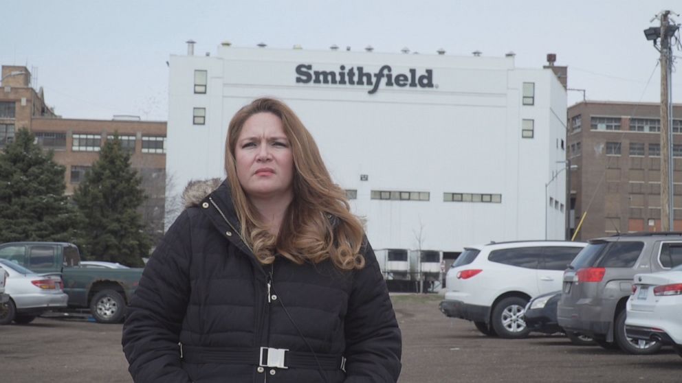 PHOTO: Nancy Reynoza, a community organizer and founder of Que Pasa Sioux Falls, stands in front of a Smithfield processing plant in Sioux Falls, South Dakota, where she says she once worked and where hundreds of people have become sick with COVID-19. 