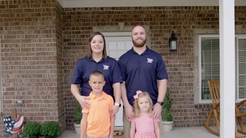 PHOTO: Nathan Shumaker, Missy Shumaker and their children stand in front of their new specially adapted home from Homes for Our Troops.