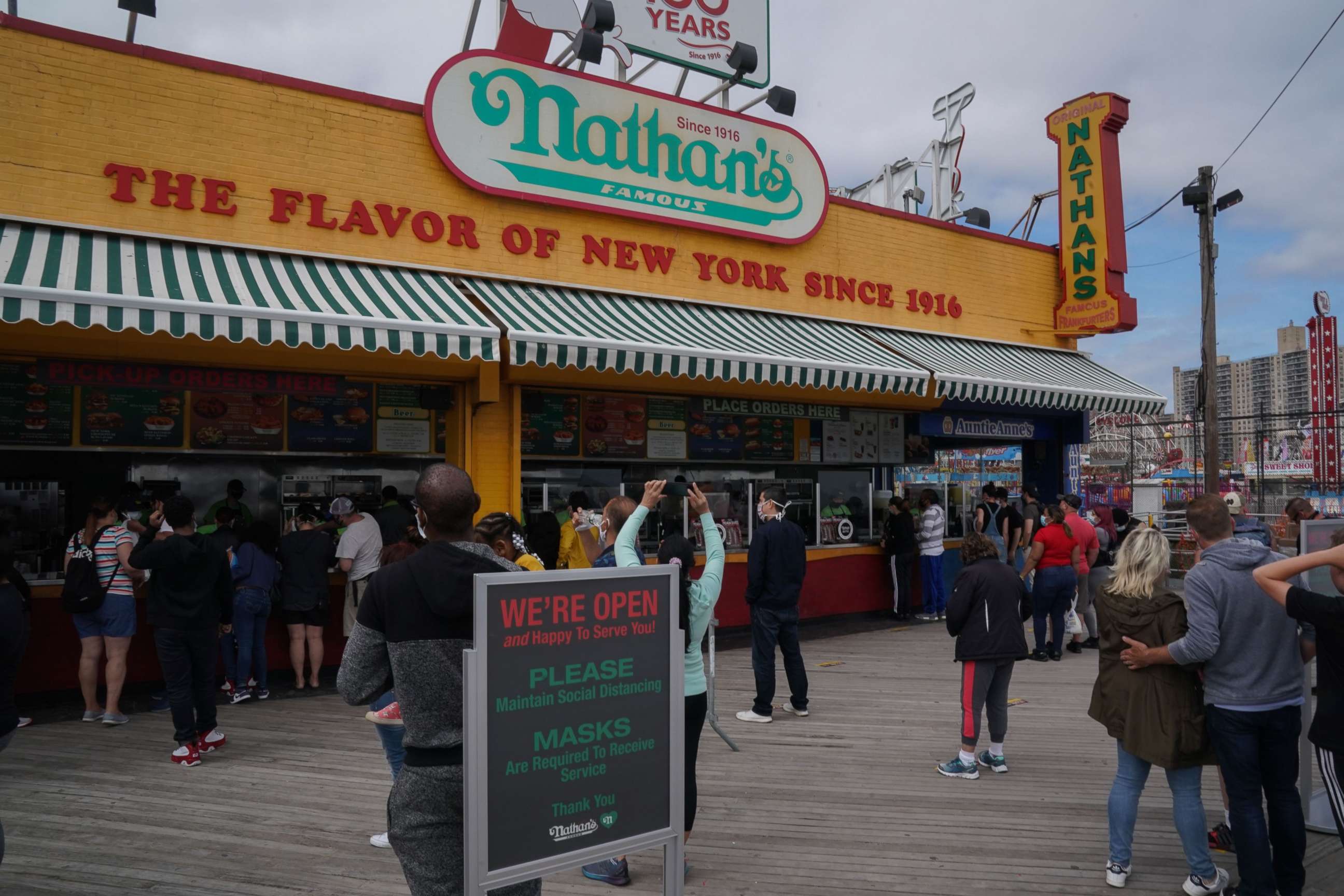 PHOTO: Nathan's Famous hotdog stand is open on the boardwalk at Coney Island amid the coronavirus pandemic on May 24, 2020 in New York.