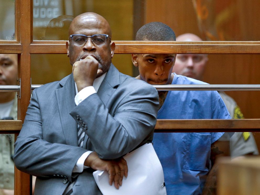 PHOTO: Eric Holder, the suspect in the killing of rapper Nipsey Hussle is seen with his attorney, Christopher Darden, front, in Los Angeles County Superior court, April 4, 2019.