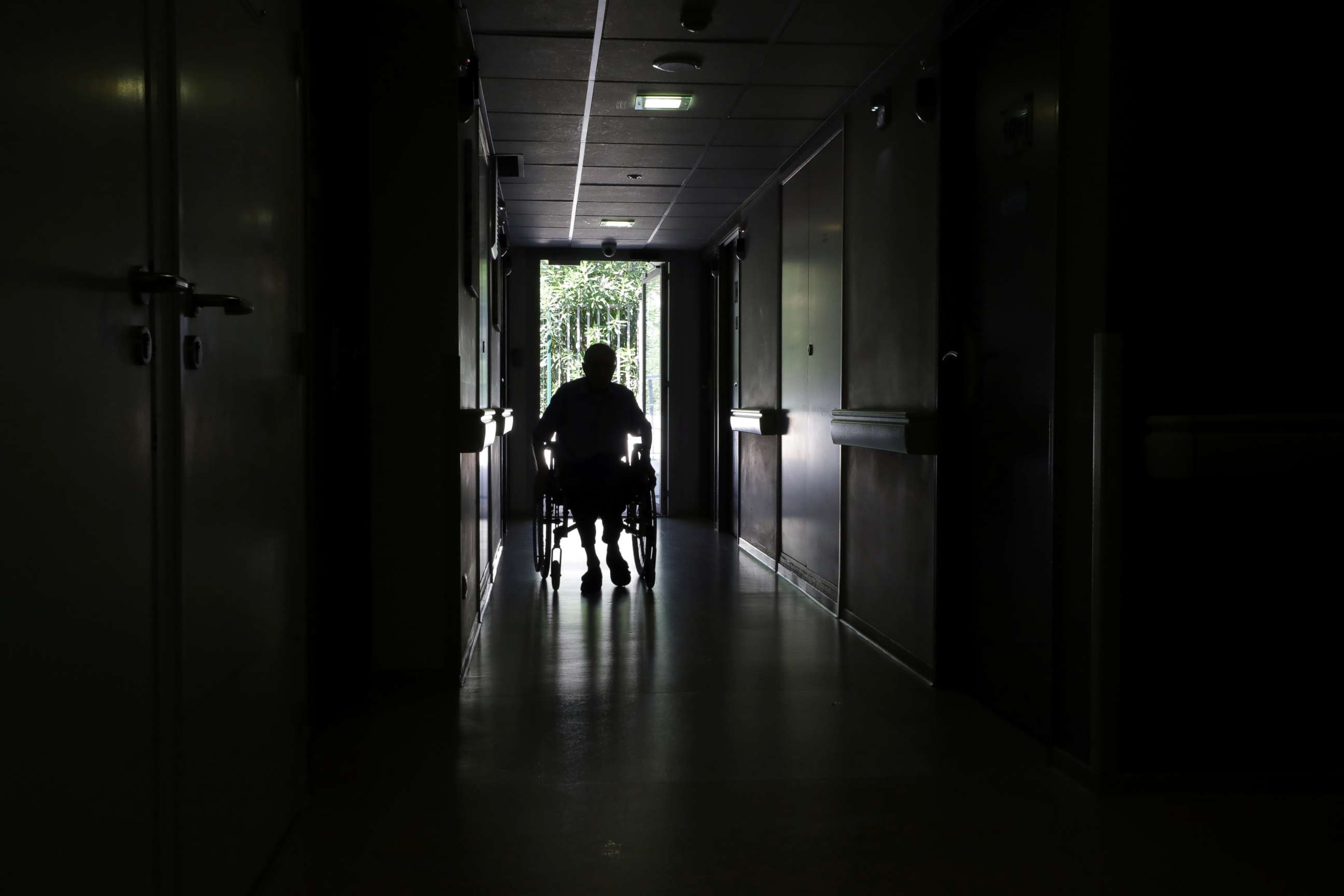 PHOTO: A resident on a wheelchair is seen in a corridor at "Les Figuiers" retirement home (Ehpad - Housing Establishment for Dependant Elderly People) amid the coronavirus disease (COVID-19) outbreak in Villeneuve-Loubet, France, September 16, 2020.  