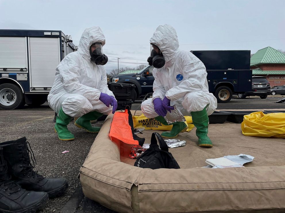 PHOTO: This photo provided by the Ohio National Guard shows 52nd Civil Support Team members preparing to enter an incident area to assess remaining hazards with a lightweight inflatable decontamination system (LIDS) in East Palestine, Ohio, Feb. 7, 2023.