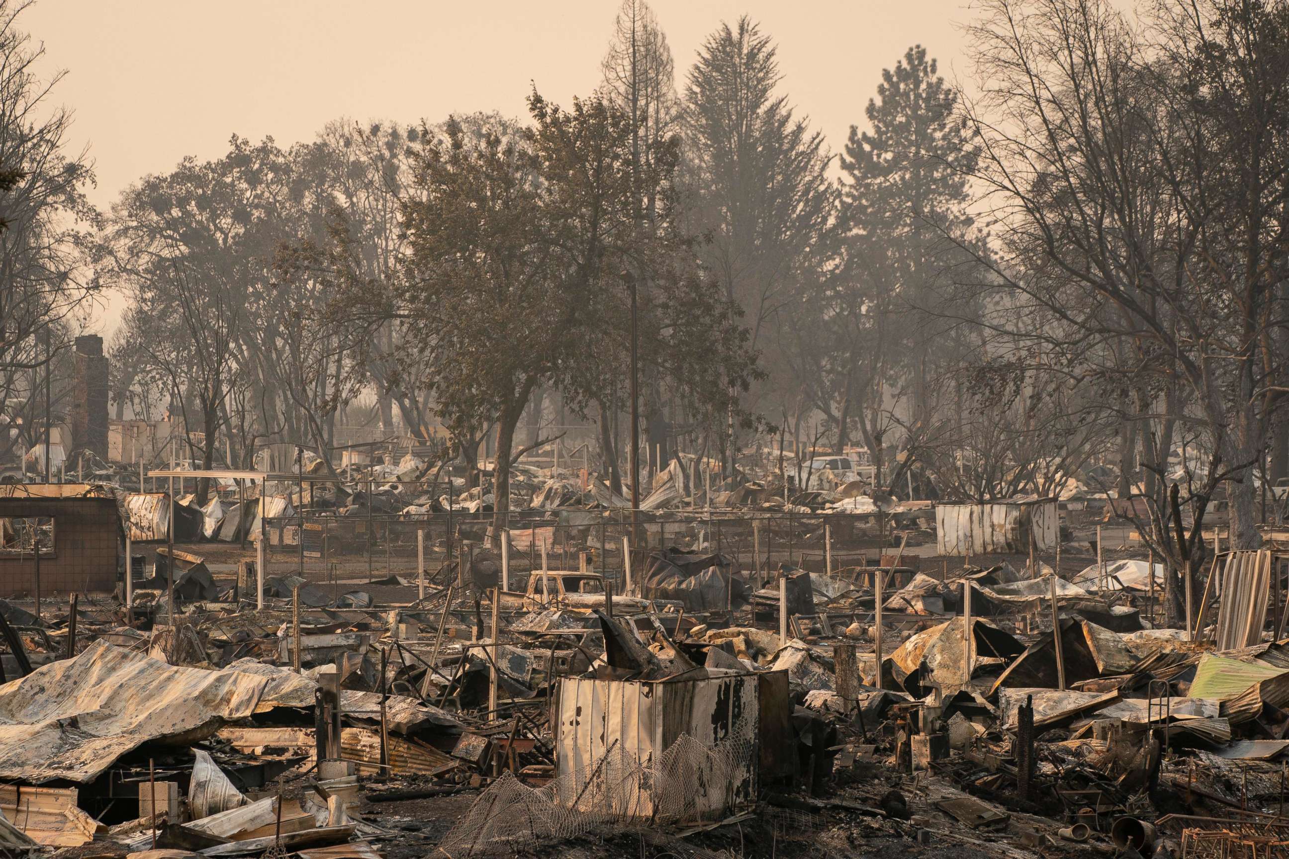 PHOTO: Damaged homes and cars are seen in a mobile home park destroyed by fire, Sept. 10, 2020, in Phoenix, Ore. 