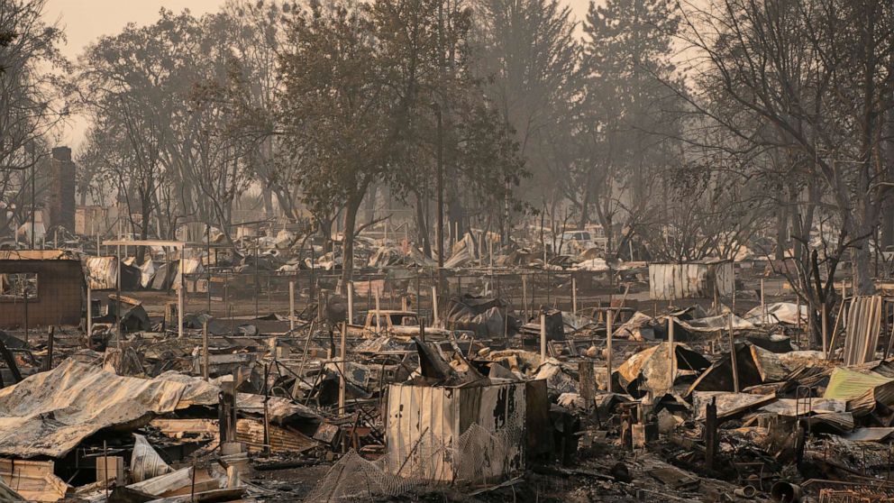 PHOTO: Damaged homes and cars are seen in a mobile home park destroyed by fire, Sept. 10, 2020, in Phoenix, Ore. 
