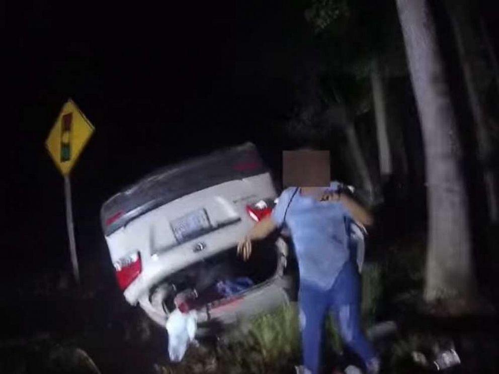 Video captures hero cop single-handedly lift overturned car off woman to  save her life - ABC News