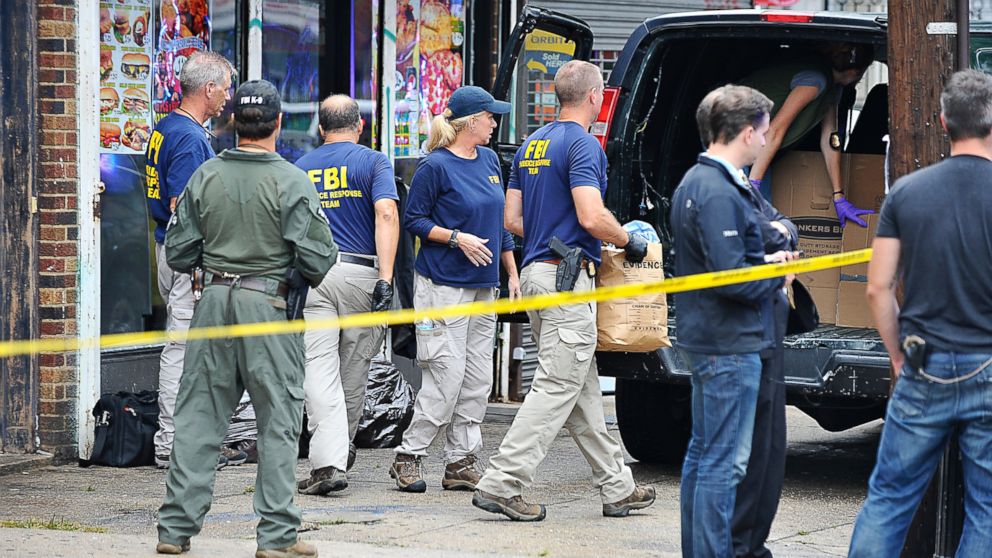 PHOTO: Police and FBI bring items out of the apartment above the First American Fried Chicken restaurant,  Sept. 19, 2016 in Elizabeth, New Jersey.