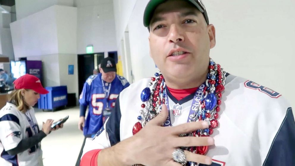 PHOTO: A Patriots fan shows off his lucky beads at Super Bowl LII in Minneapolis. 