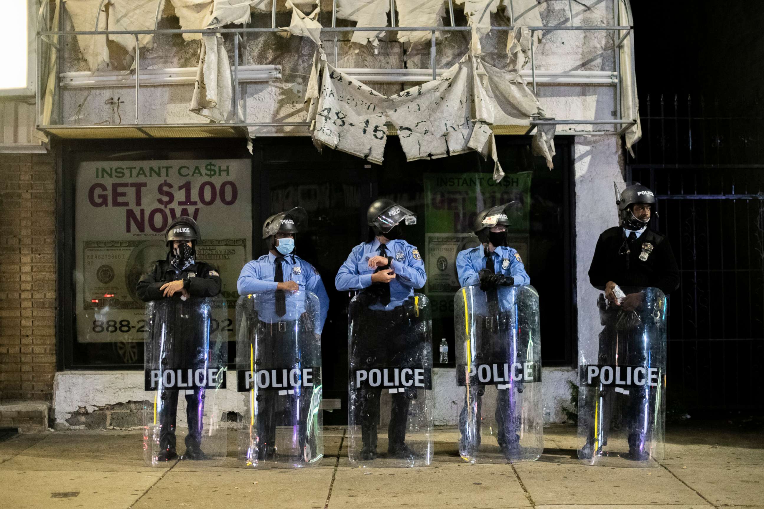 PHOTO: PHILADELPHIA, PA - OCTOBER 28:  Police officers congregate an hour before a citywide curfew, on October 28, 2020 in Philadelphia, Pennsylvania. 