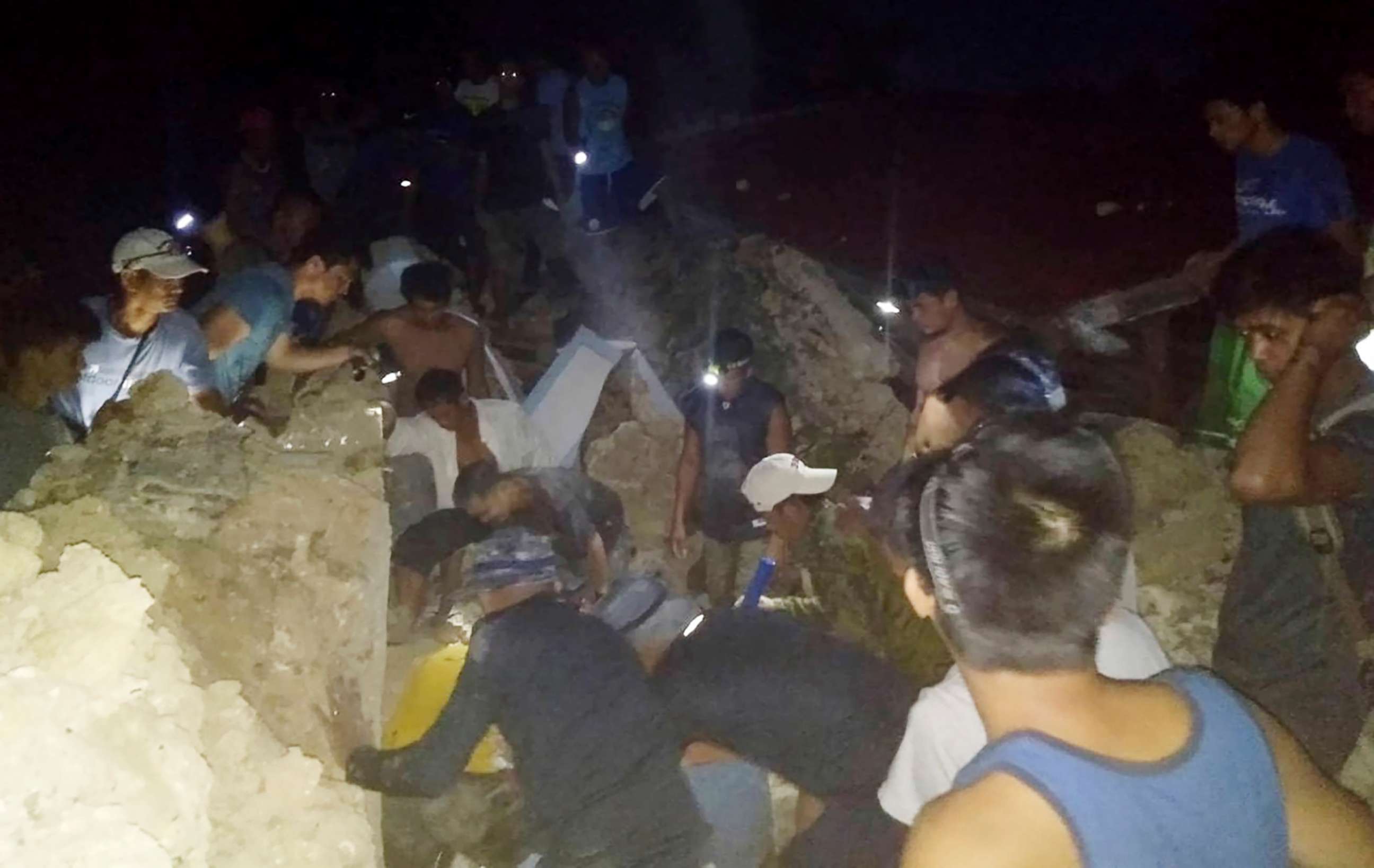 PHOTO: Rescuer teams search for survivors following two earthquakes that struck the northernmost island of Itbayat, Batanes province in northern Philippines, July 27, 2019.