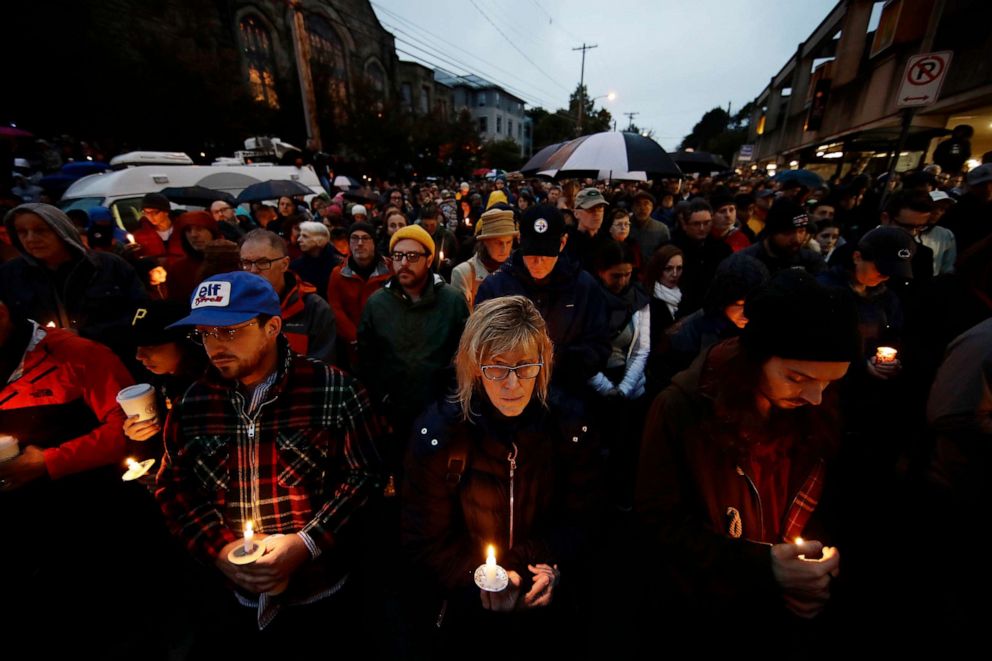 PHOTO: People hold candles as they gather for a vigil in the aftermath of a deadly shooting at the Tree of Life Congregation, Oct. 27, 2018, in Pittsburgh.