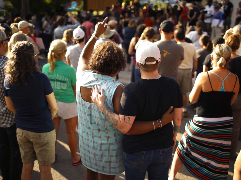 PHOTO: A crowd gathers to remember an Australian woman who was shot and killed late Saturday by police, Sunday evening, July 16, 2017, in Minneapolis.