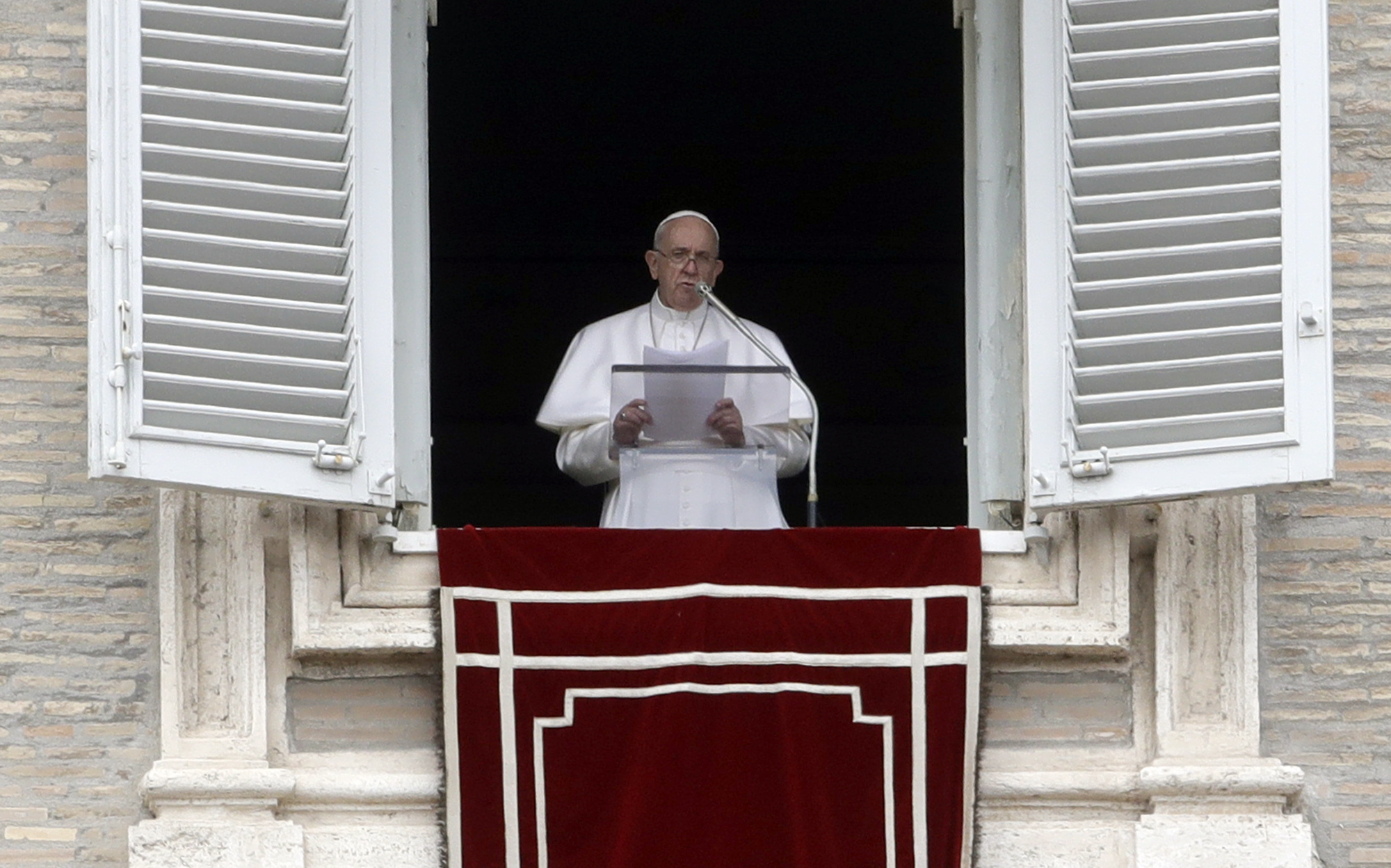 PHOTO: Pope Francis delivers his message during the Angelus noon prayer from the window of his studio overlooking St.Peter's Square, at the Vatican, March 17, 2019. 