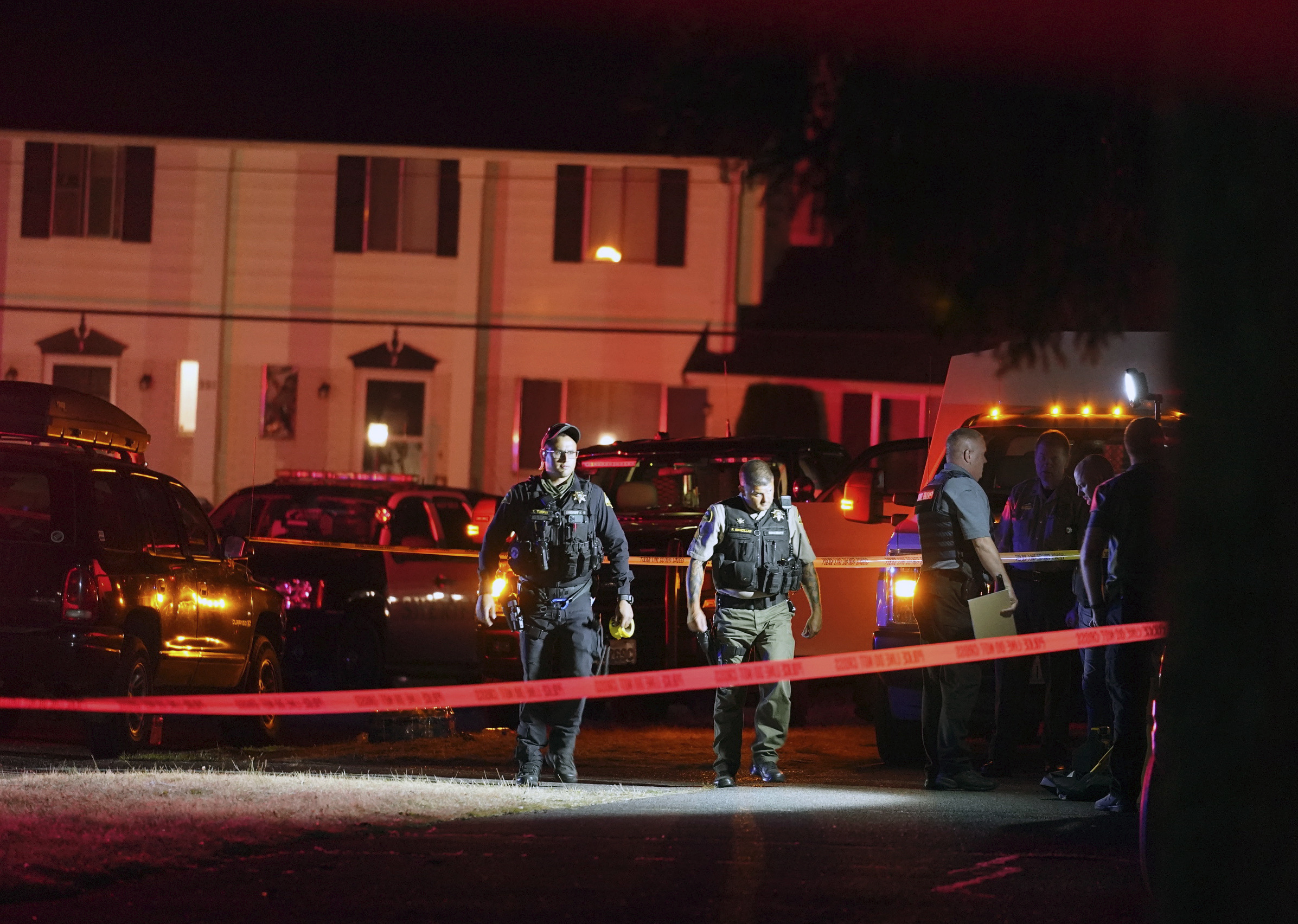 PHOTO: Police officials work at a scene where a man suspected of fatally shooting a supporter of a right-wing group in Portland, Ore., last week was killed as investigators moved in to arrest him in Lacey, Wash., Thursday, Sept. 3, 2020. 