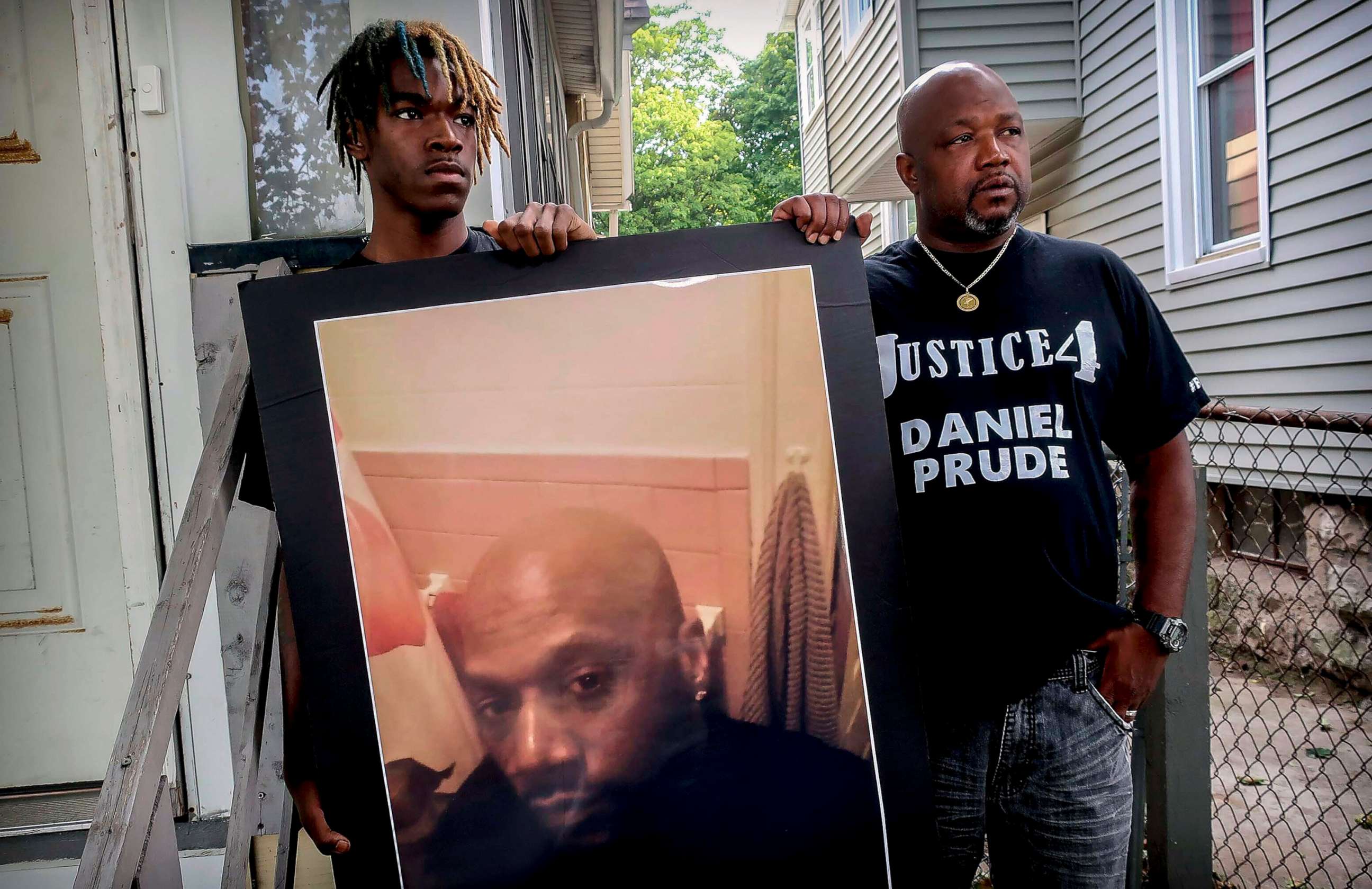 PHOTO: Armin Prude, left, and Joe Prude hold an enlarged photo of Daniel Prude, Sept. 3, 2020, who died following a police encounter, in Rochester, N.Y. 