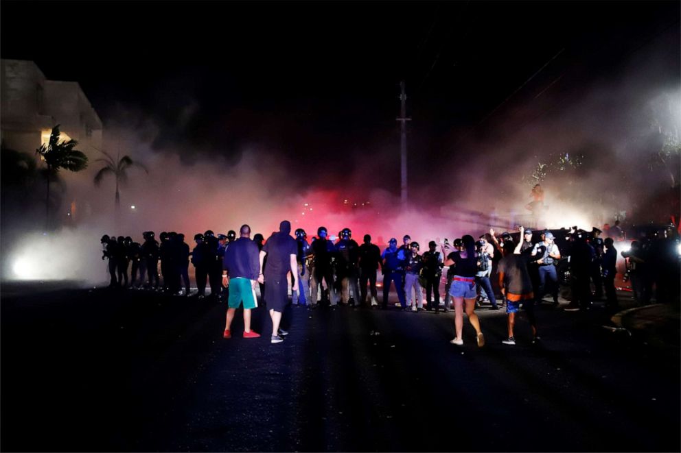 PHOTO: Protesters face the police at the Yolanda Guerrero Cultural Center, in Guaynabo, Puerto Rico, July 21, 2019.